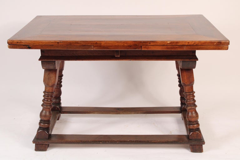 Continental probably Portguese, baroque style walnut, draw leaf dining room table, 19th century. With two 18
