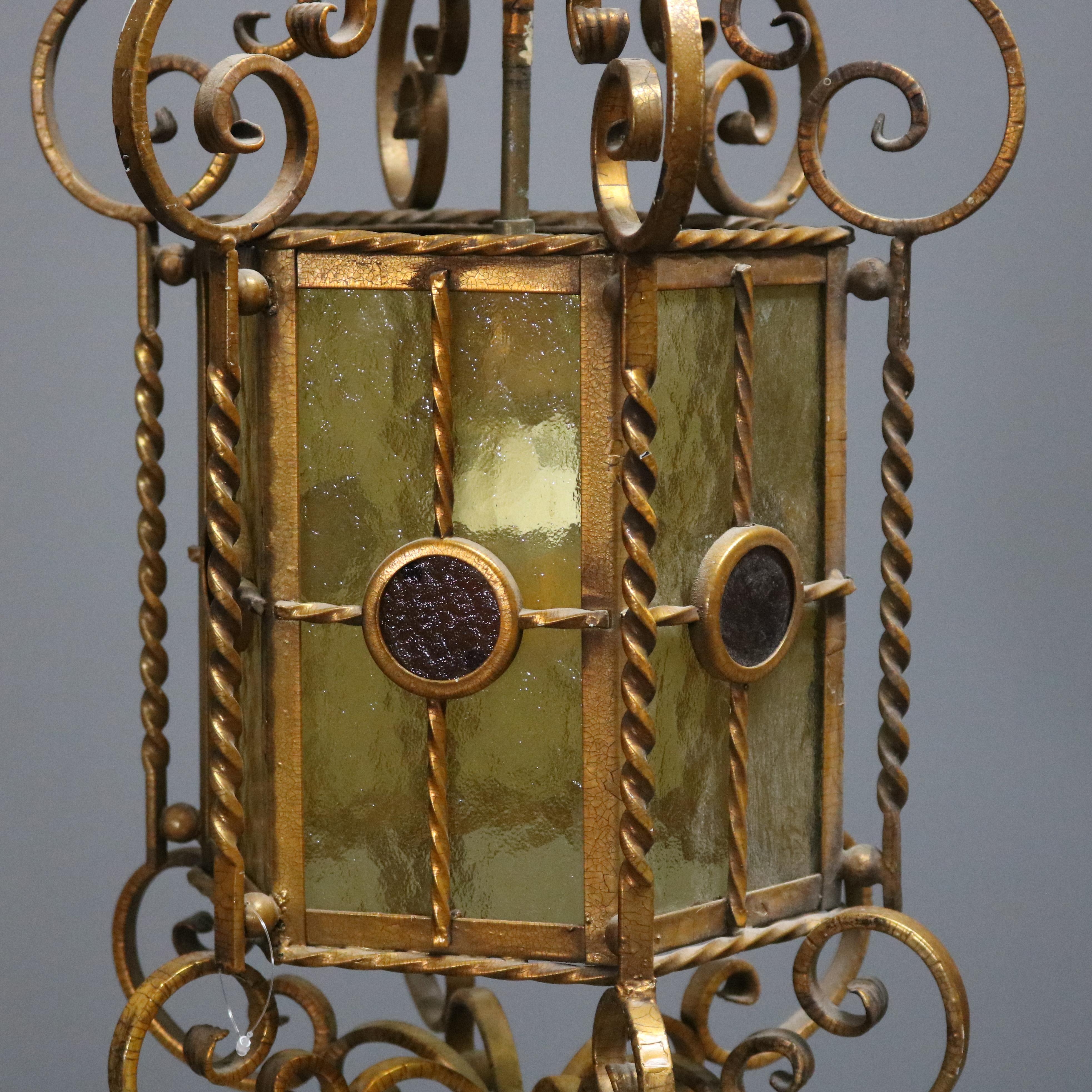 Continental wrought iron hanging pendant offers six sides having glass panels with scroll and rope twist single socket frame, circa 1920.

Measures: 37