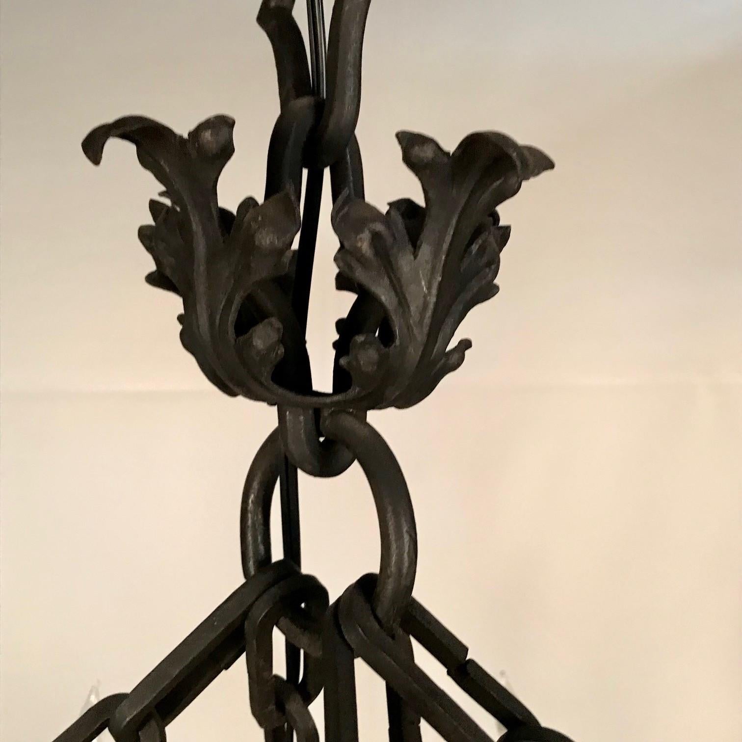 Hammered Antique Continental Wrought Iron Chandelier For Sale