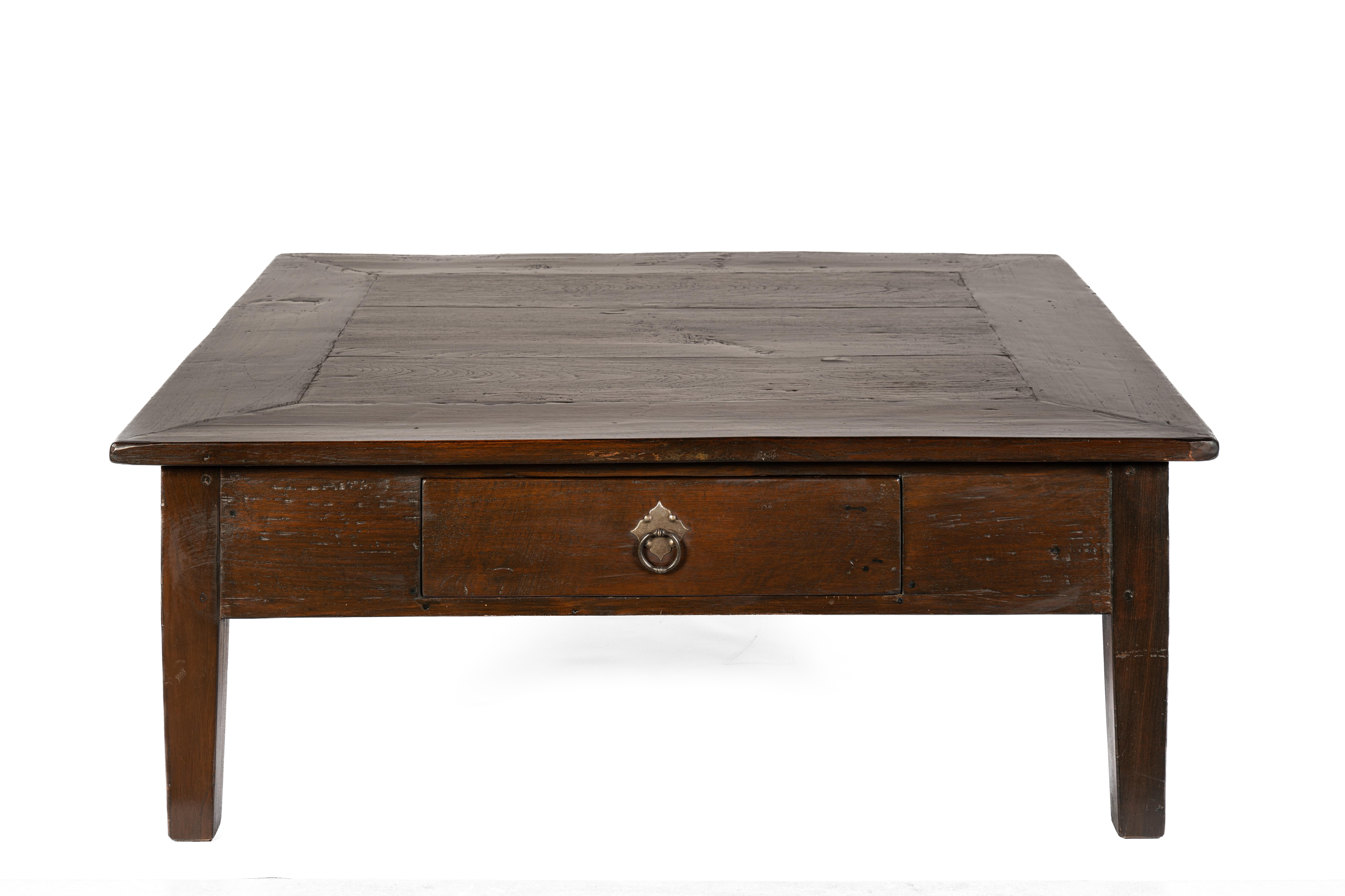 This impressive, large coffee table is crafted from solid teak and carries with it a rich and layered history. Originally made around 1845 on the island of Java—then part of the Dutch East Indies, now Indonesia—it was initially designed as a