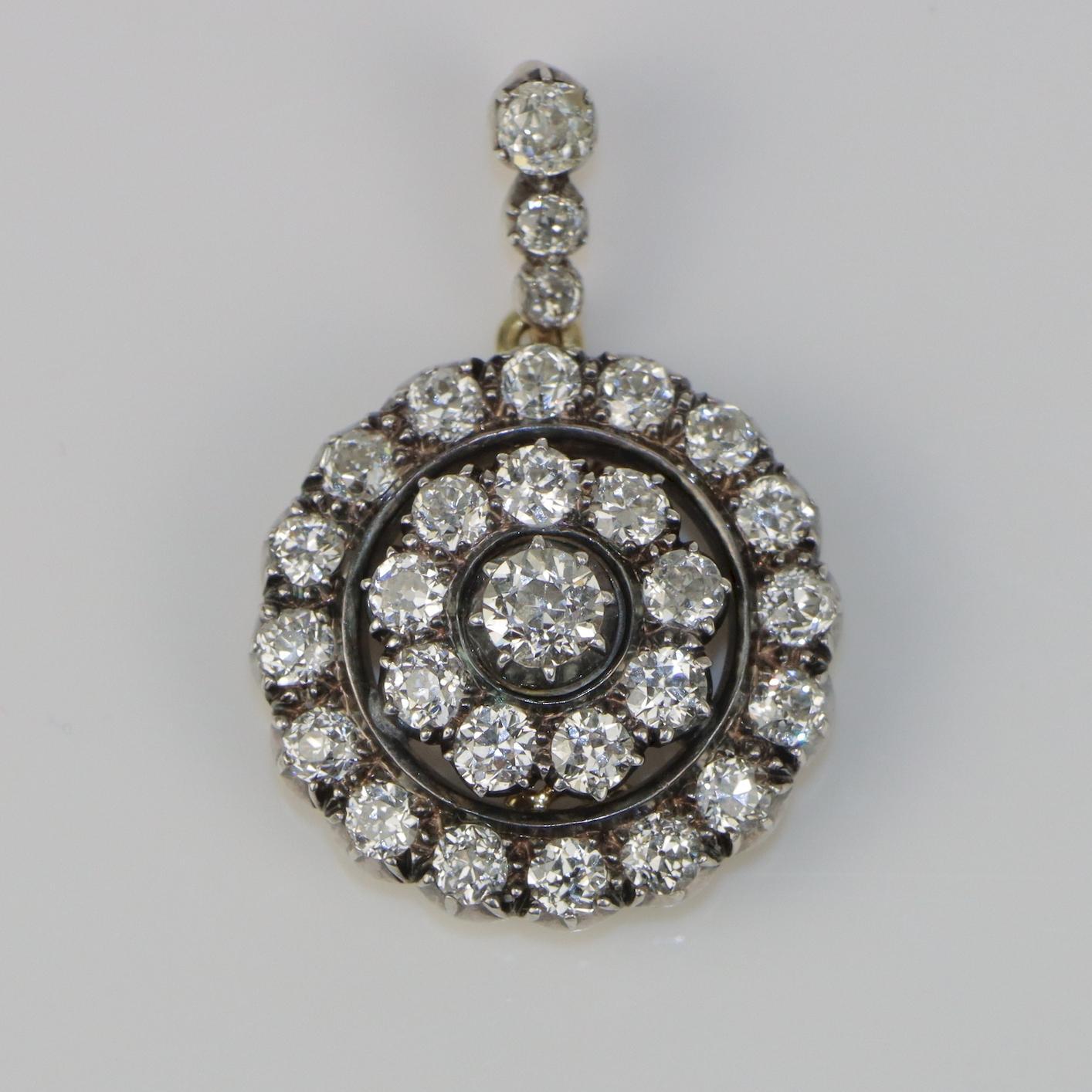 Antique Convertible Platinum & 18K Gold 4.70 Carat Diamond Pendant Brooch 

A Fine example of a Antique Platinum & 18K Gold Diamond Pendant / Brooch - The pendant is convertable and can be converted to a brooch pin with a screw-attachment as shown