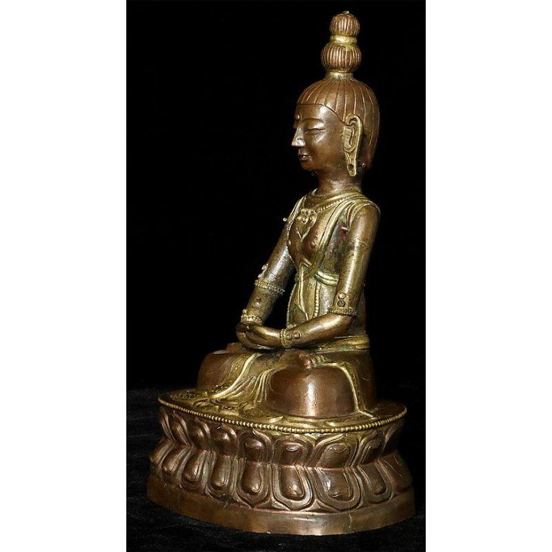 Material: Copper
Material: wood
21,5 cm high 
Weight: 0.416 kgs
Gilded with 24 krt. gold
Dhyana mudra
Originating from Mongolia
18th century
The original bowl is missing
In very high quality, with a great expression !.

