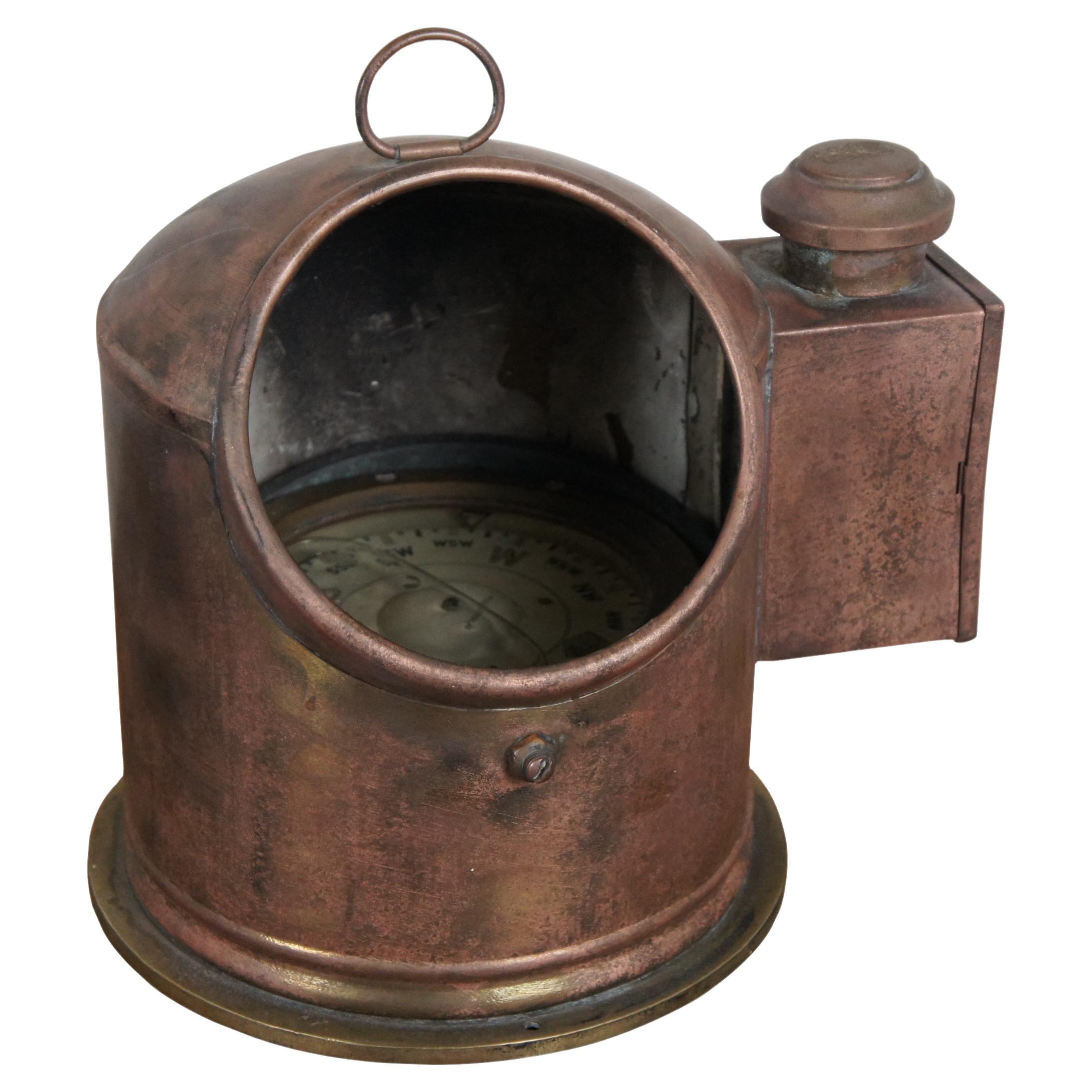 Antique English nautical ship / Yacht / lifeboat gimbal compass / binnacle. Copper and brass body with single oil lamp on one side for illumination. Gimbal Sestrel compass marked No. B4/12629L/49. Inner ring marked 5613.

Dimensions:
11.5