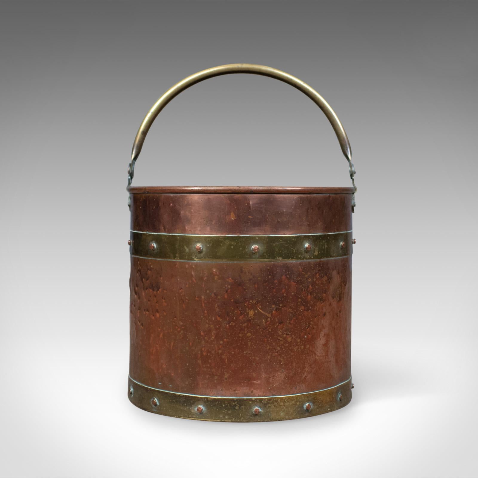 This is an antique copper coal bin, an English, Victorian, fireside scuttle bucket dating to the late 19th century, circa 1890.

A pleasing fireside storage bin presented in good antique condition
Suitable for coal, logs and kindling or helpful