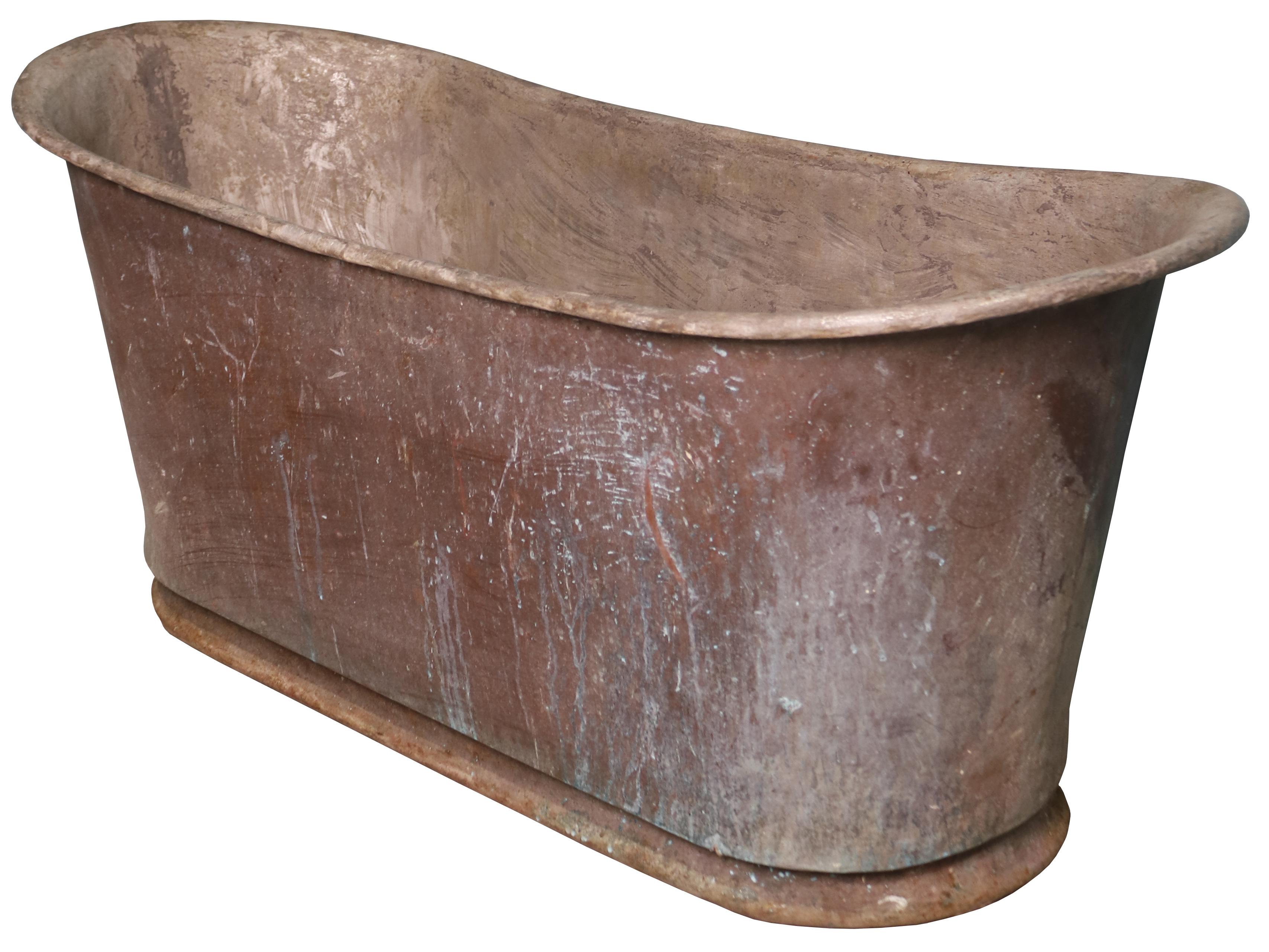 Antique copper double ended bath. A beautiful Zinc coated, copper bath with a rolled top salvaged from an Oxfordshire country home. A perfect way to add some rustic charm to a contemporary space.