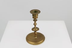 Antique copper Flemish disc candlestick from the 15th century