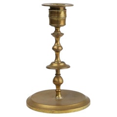 Antique copper Flemish disc candlestick from the 15th century