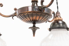 Lámpara colgante «Electrolier» de GEC Holophane con cristal prismático y acabado en cobre antiguo, hacia 1910
