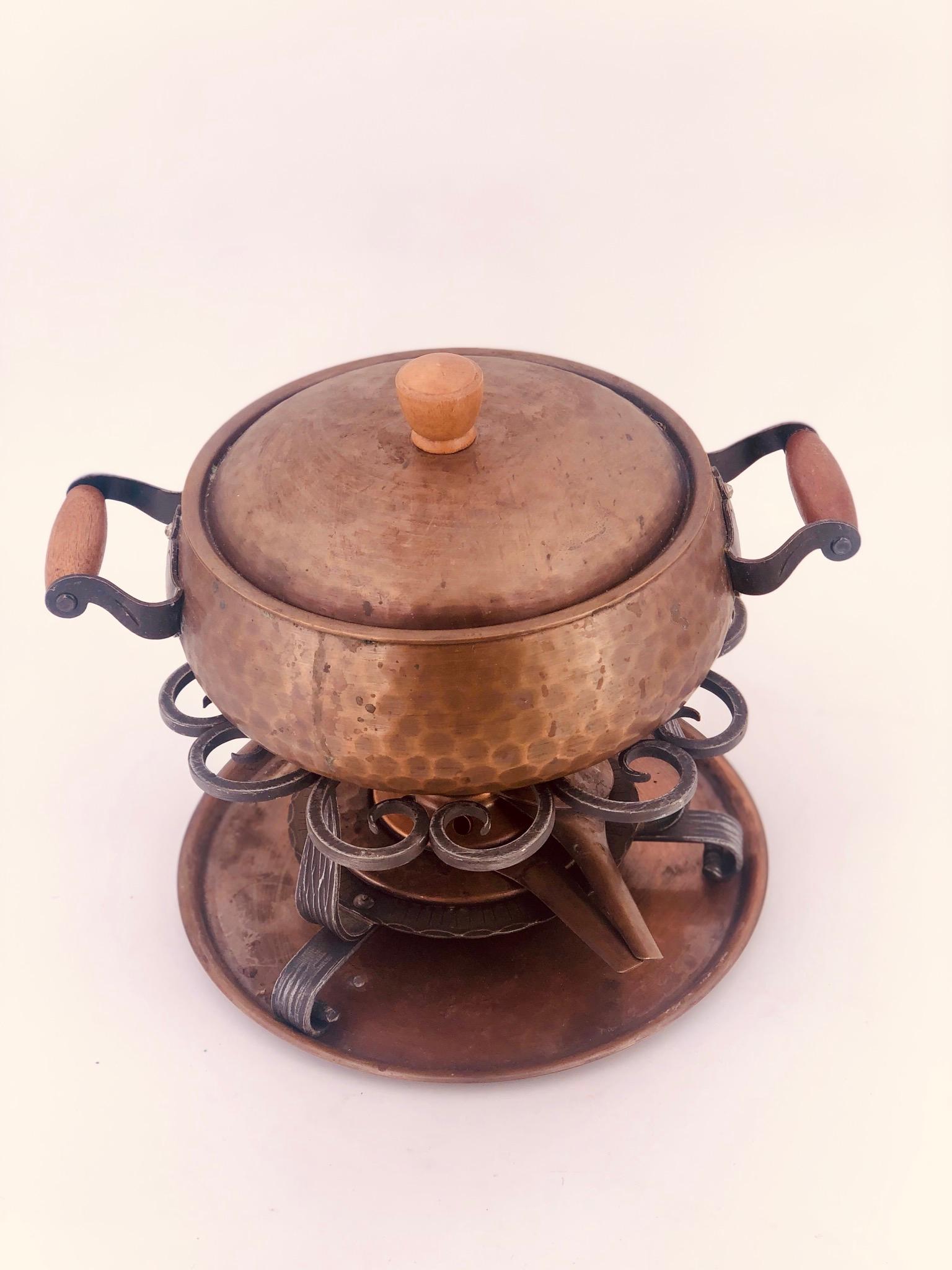 Antique copper hammered Fondue Casserole & Burnner by Stockli Netstal Switzerland, circa 1970s condition it's lightly used, comes with original boxes and manuals.