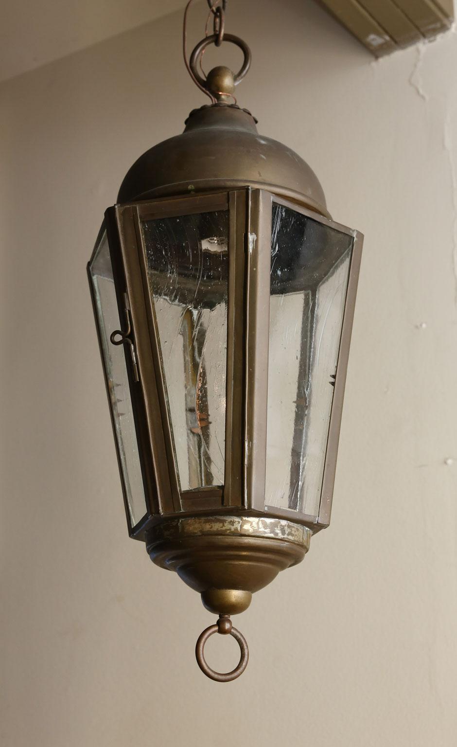 The lantern has been newly wired in the US and has reproduction German wavy glass installed. It has been newly wired in the US. The patina is nice and original. There is just one of these lanterns. The measurement is to the top of the lantern and