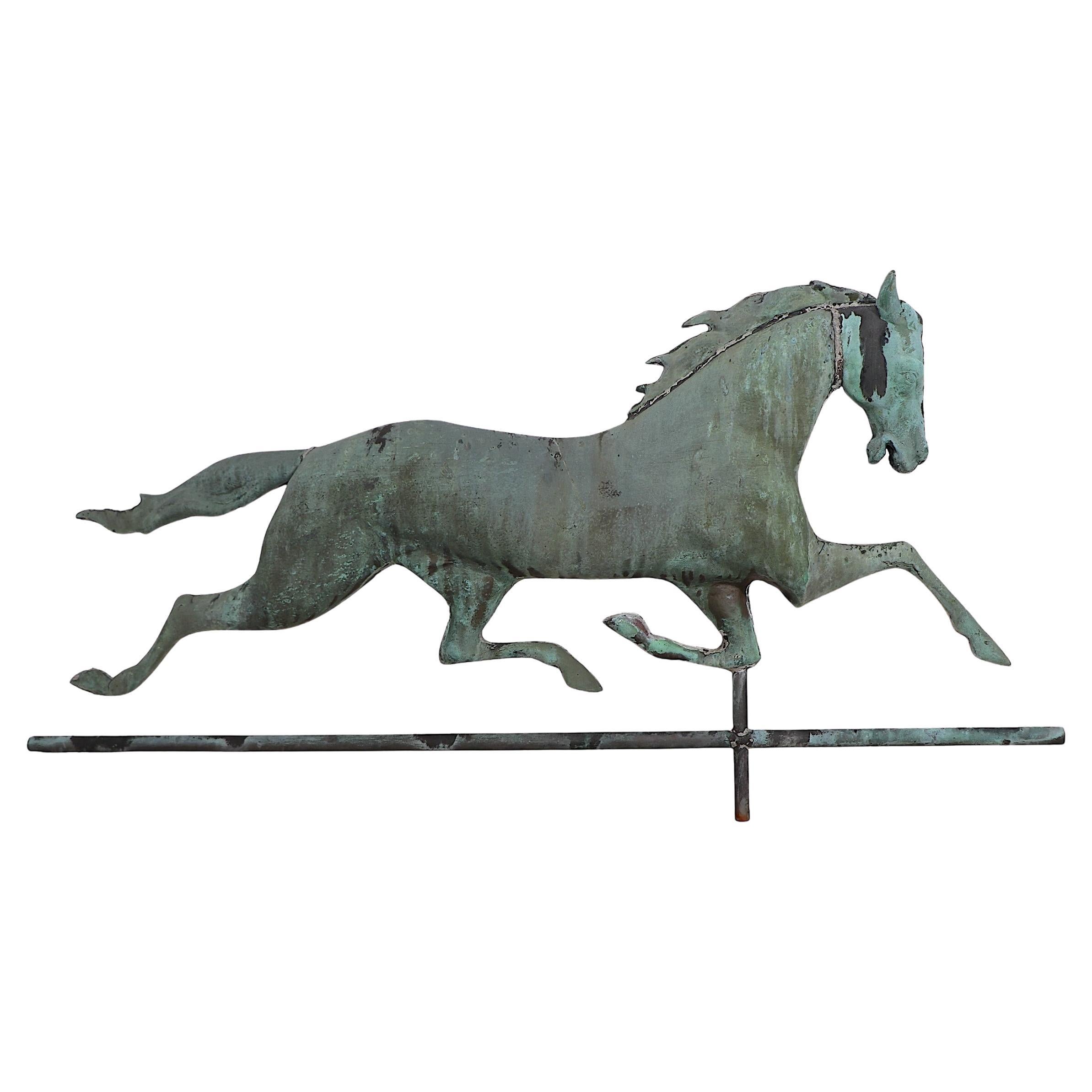 Nice early American copper horse weather vane circa late 19th C / early 20th c. , complete with the wind direction letters. The horse is constructed of copper with a hollow body and solid head. The horse is in excellent, original condition, free of