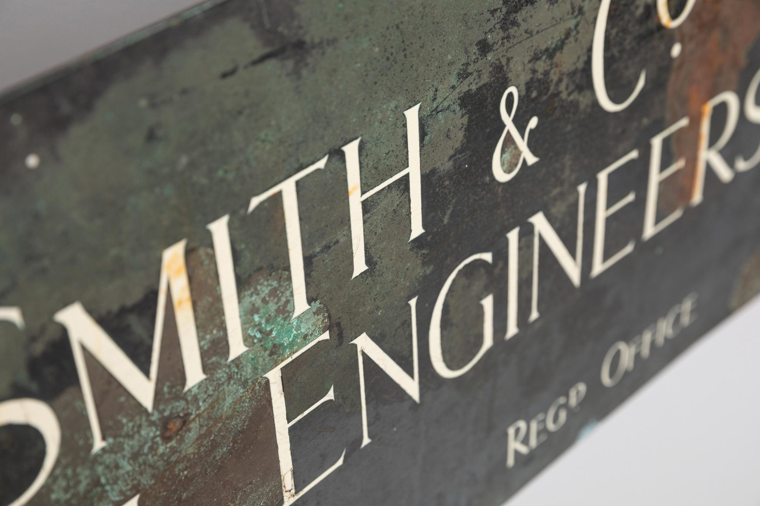 A beautiful copper trade sign. c.1920

Wonderful patination and depth of colour built up to the surface through oxidation from years of exposure to the elements. Elegant type engraved and inlaid to the sign. Single sided with fixing holes to each