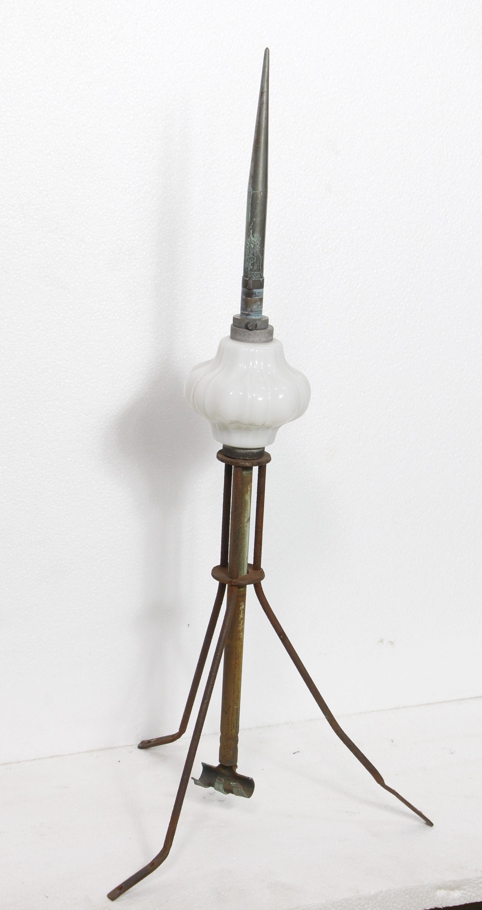 Antique turn of the century copper lightning rod. These were attached at the top point of a building with a metal connecting it to the ground. If the rod was struck by lighting typically the white glass indicator shade would break and show the rod