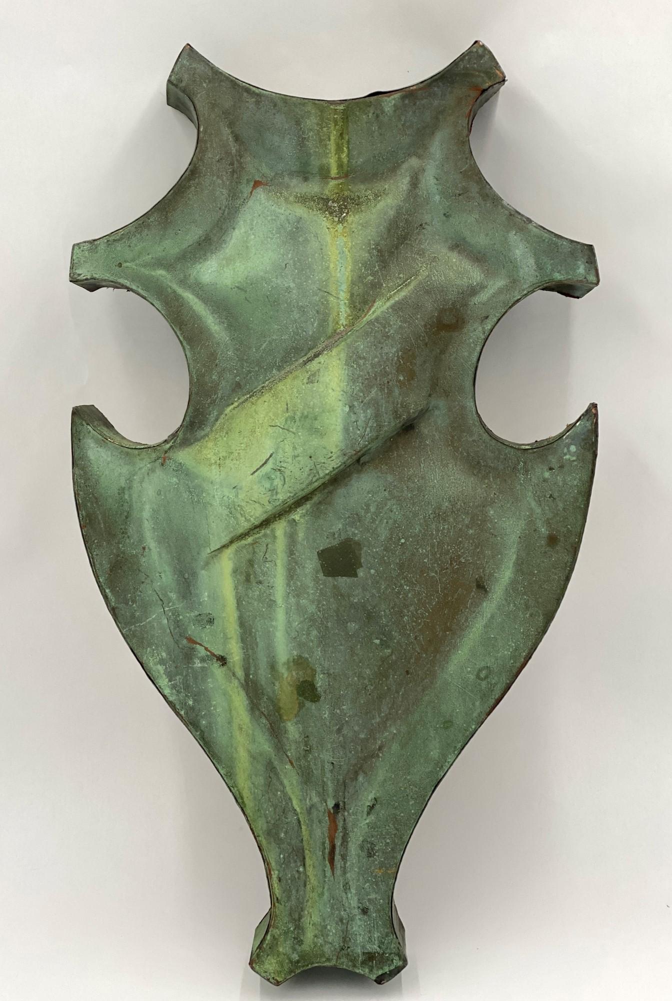 Early 20th century copper shield with original verdigris patina recovered from NYC building soffit. Now mounted on plywood and ready to hang as a wall ornament. Priced each. This can be seen at our 333 West 52nd St location in the Theater District