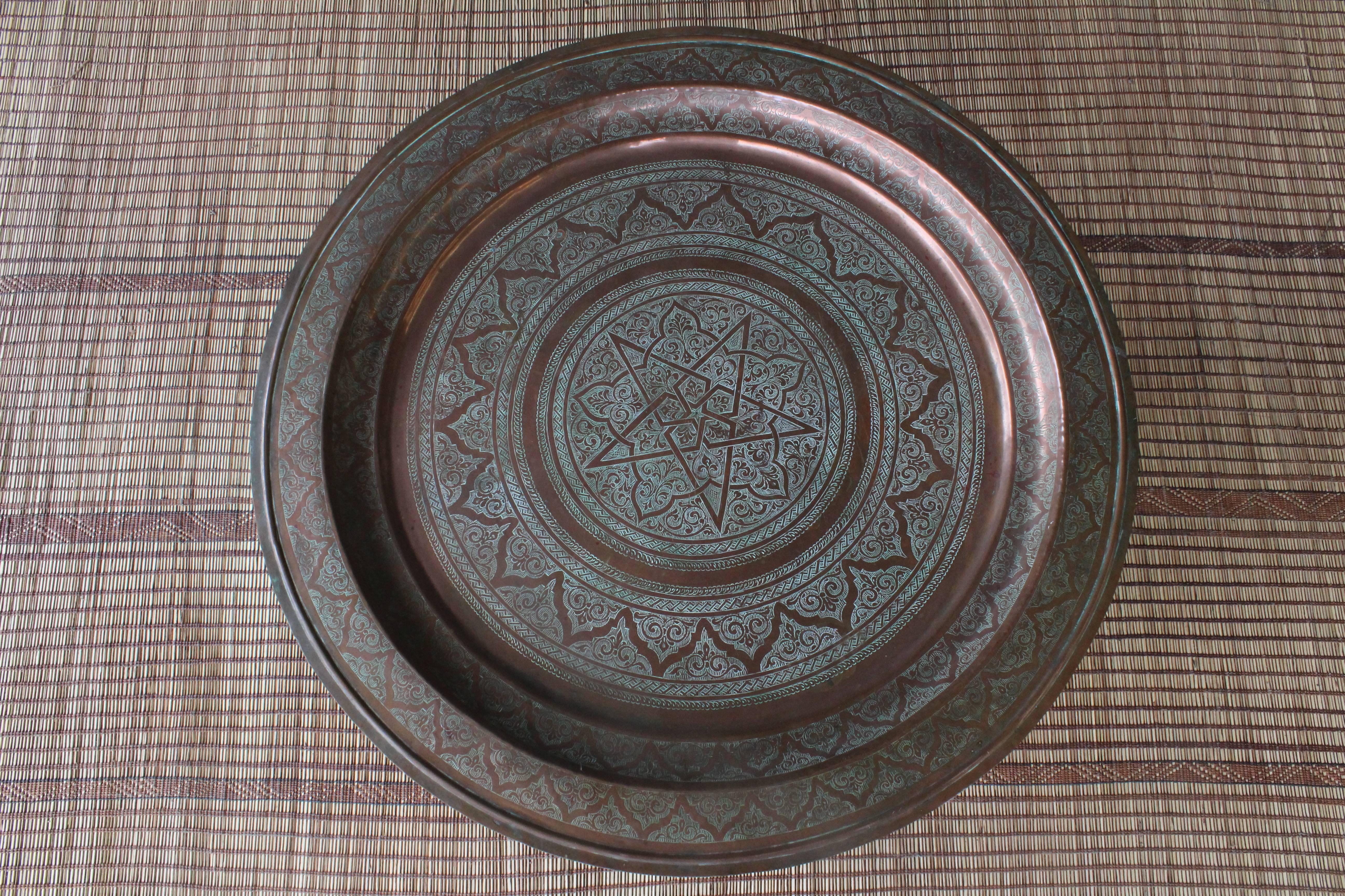 Antique Indian copper tray with a custom made base. Perfect as a cocktail or coffee table.