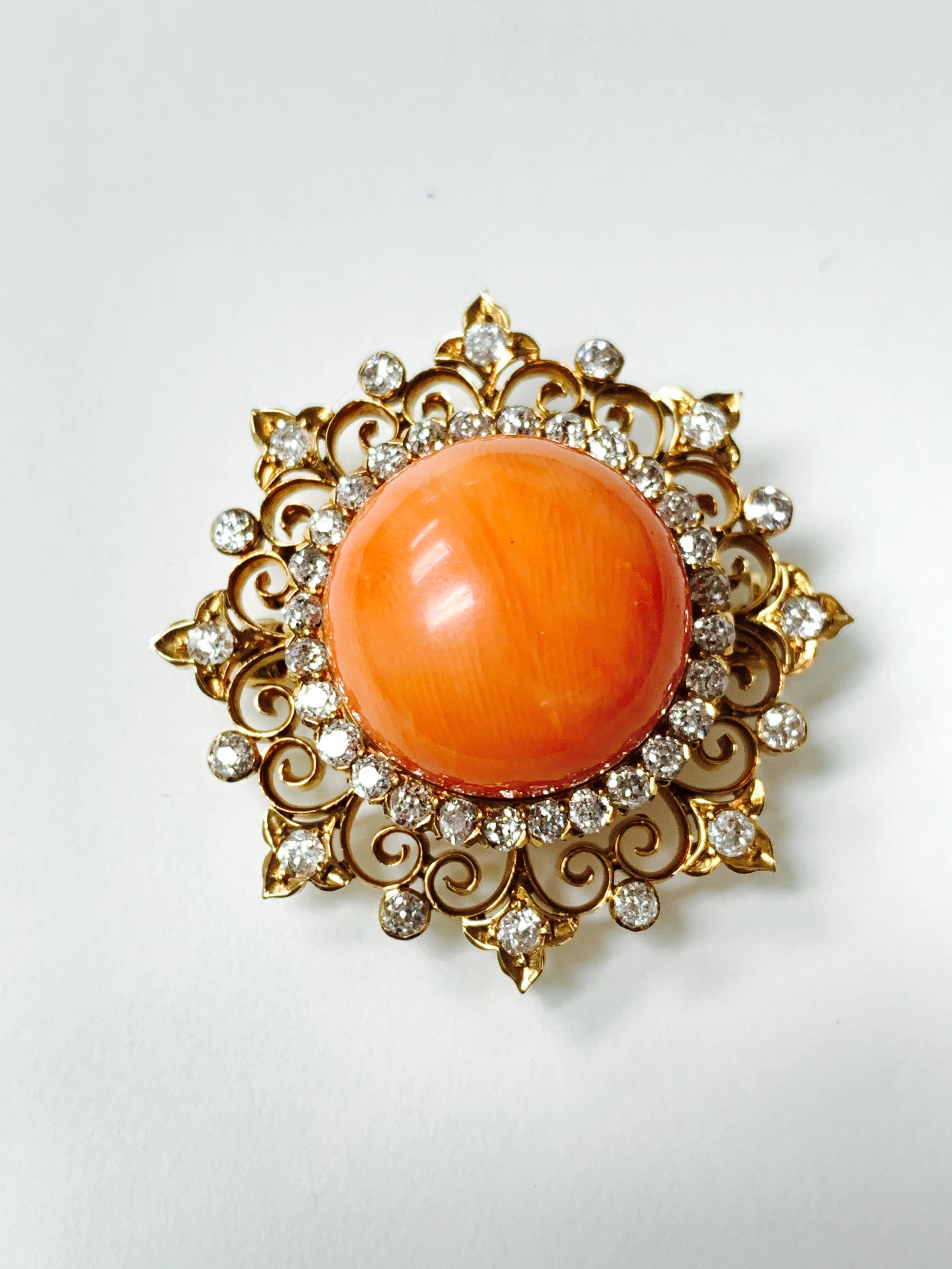 Moguldiam Inc Antique Coral And Diamond Broach In Yellow Gold. 

Coral Measurement : 17.3mm - 17.5mm-12mm 
Diamond weight : 2 carat 
Measurements of the Broach : 1 1/2 by 1 1/2 inches
