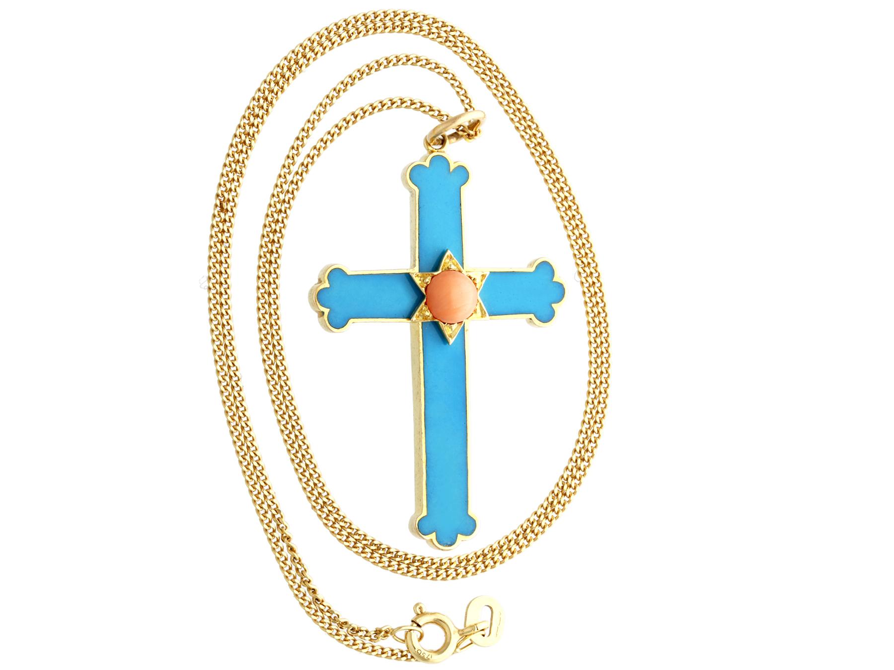 A fine and impressive antique 0.38 carat coral and 14 karat yellow gold cross pendant; part of our diverse diamond jewelry and estate jewelry collections.

This fine and impressive antique pendant has been crafted in 14k yellow gold.

The pendant