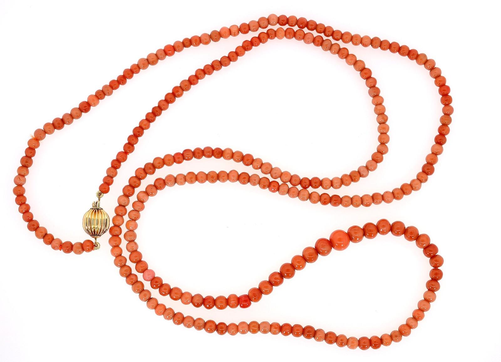 This beautiful long strand features 250 soft and dark salmon color Coral beads.  The recently re-strong 1930's strands measures 38 inch long, making it easy to be worn nestled into two strands or simply leave it at length.  A contemporary round 14KT