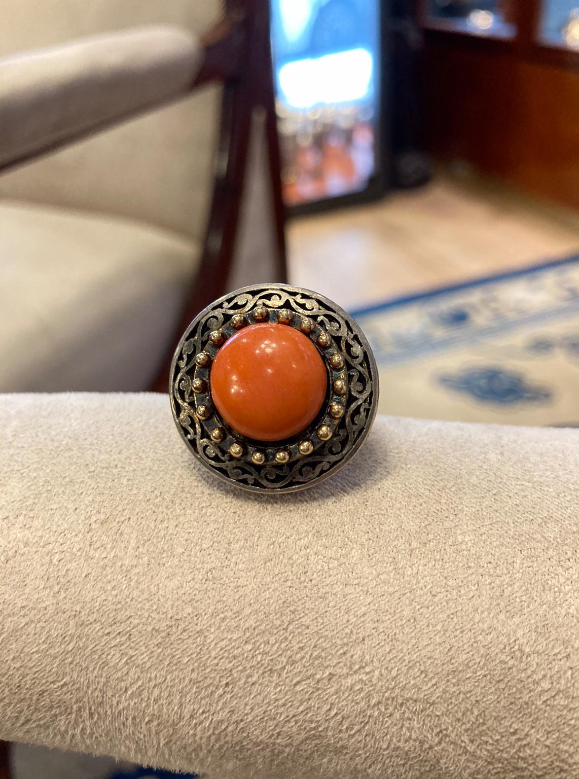 A beautiful antique coral ring with a yellow gold and silver mounting. Likely a Georgian period button converted into a ring at some point during the late nineteenth - early twentieth century.