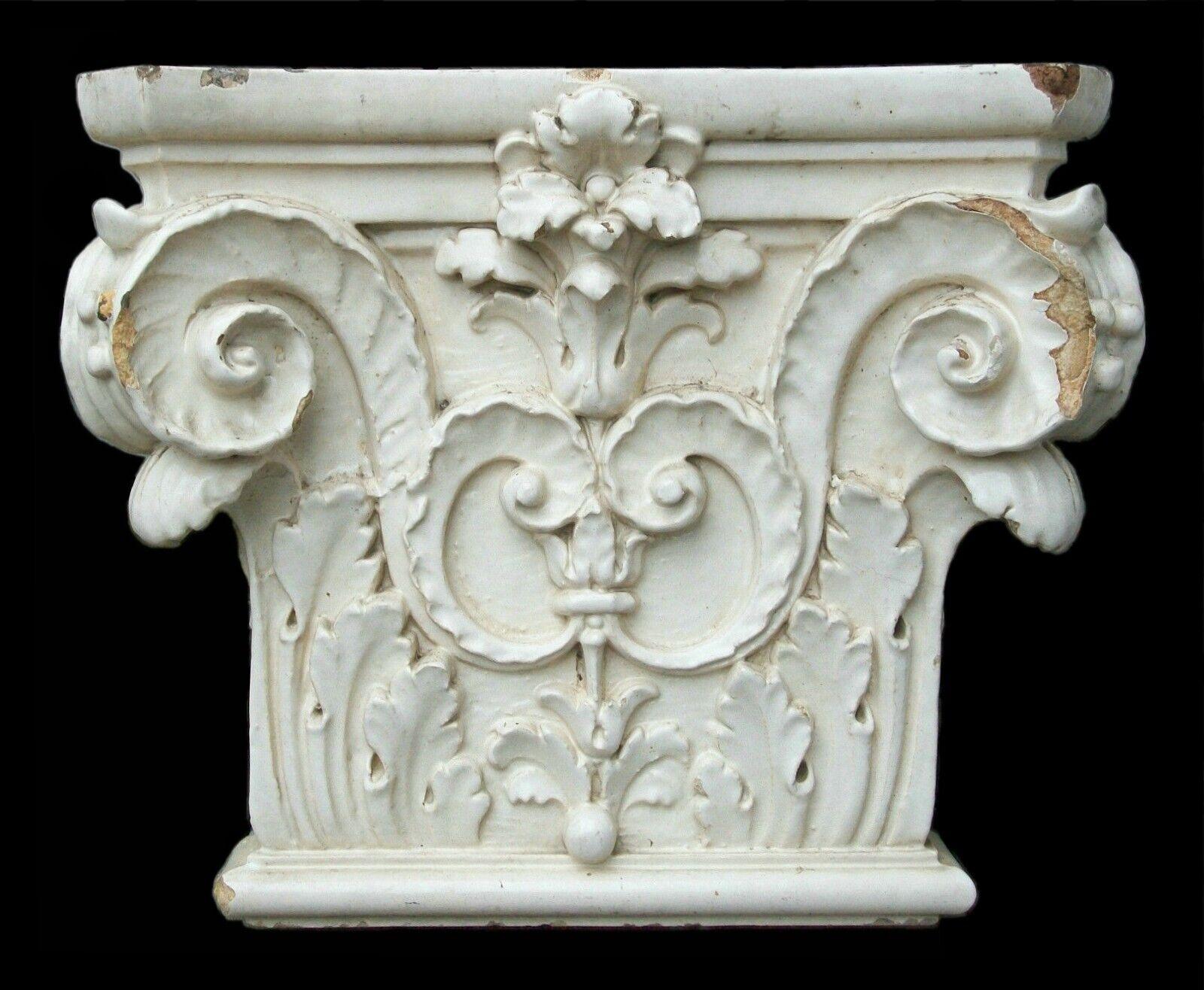 Antique Architectural Corinthian Capital - glazed cast ceramic composition - Canada or United States - late 19th century.

Good antique condition - chips/loss to the body & glaze - grime that comes with age - concrete residue & inset bricks to the