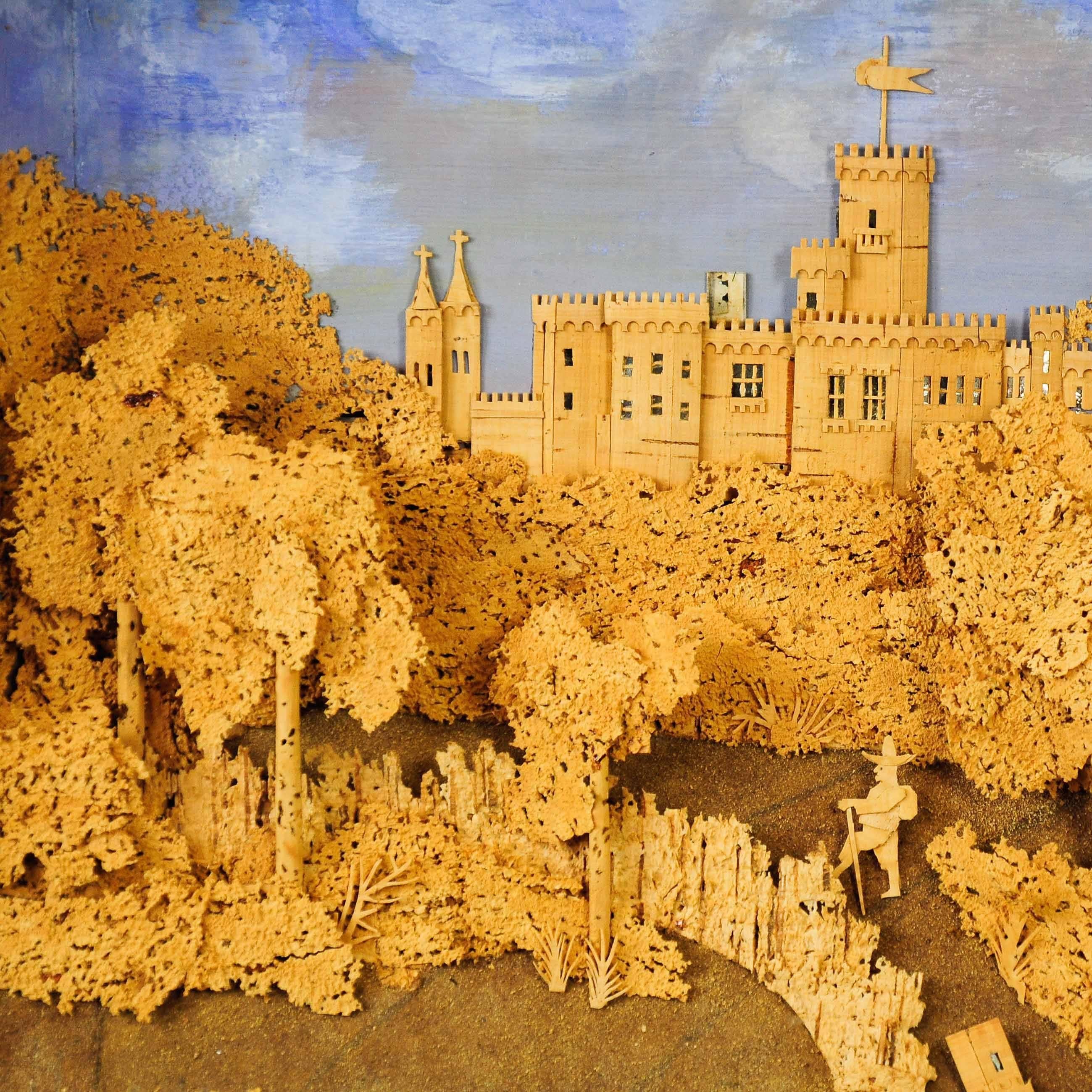 A fine tri-dimensional / diorama cork carving of a scenery with castle, trees and rambler behind glass, with a carved wood frame, gold-painted. Executed, circa 1880.

Measures: Width 21.65