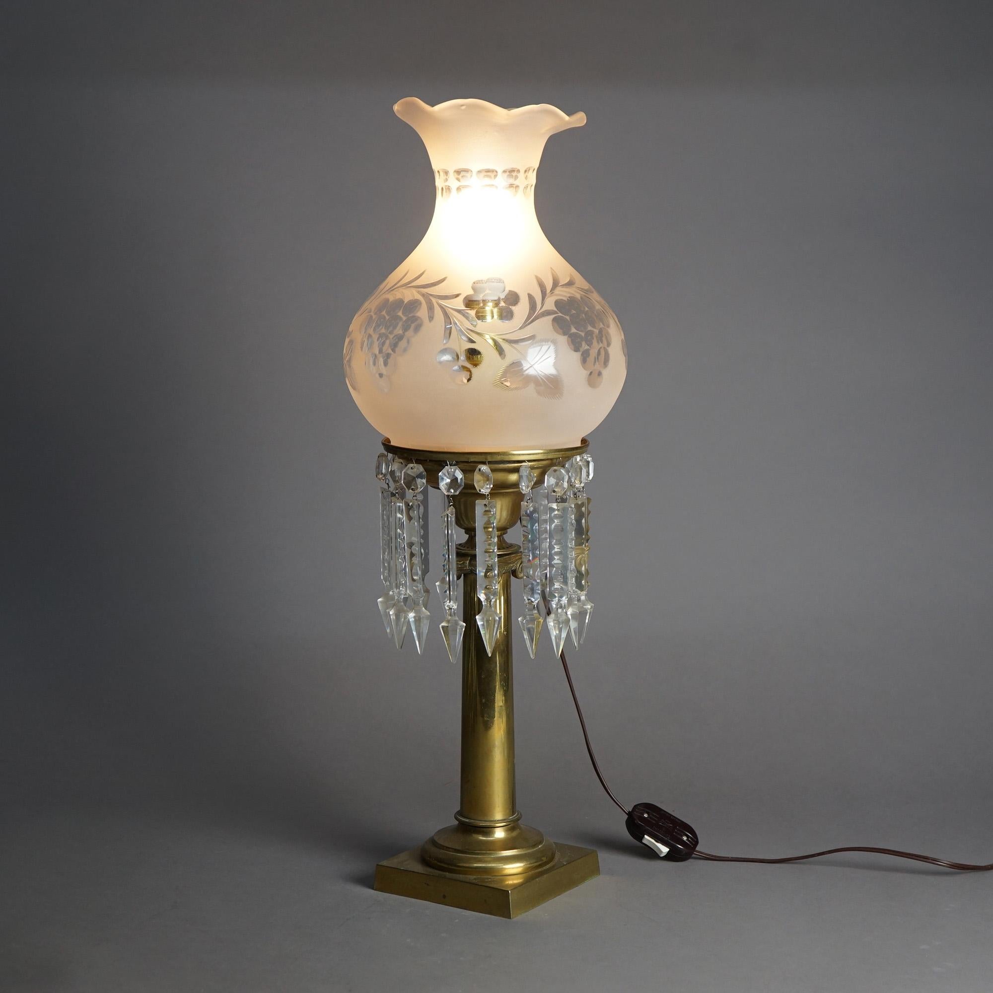 An antique solar lamp in the manner of Cornelius offers Classical form with cut back glass shade over brass base with hanging cut crystals, electrified, c1840

Measures- 25''H x 8.25''W x 8.25''D