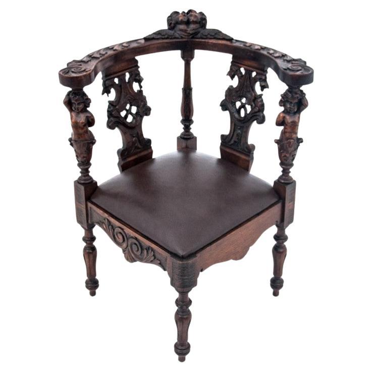 Sillón esquinero antiguo, Europa occidental, hacia 1900.