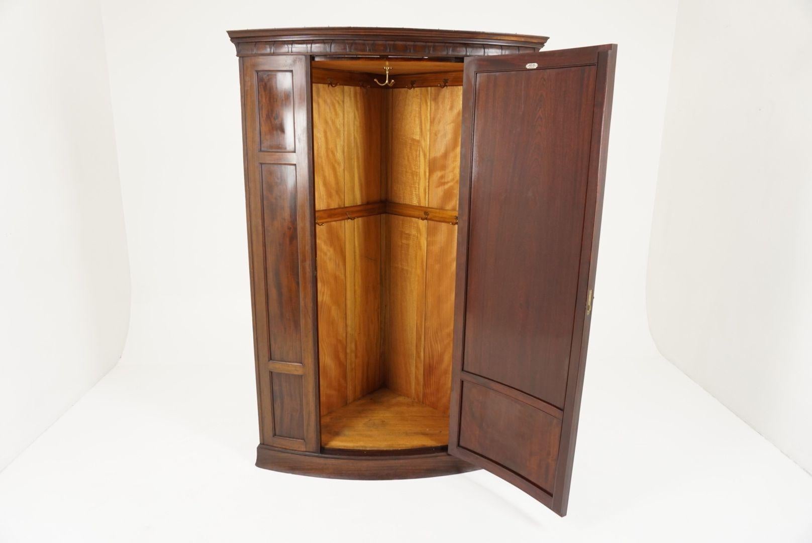Antique corner wardrobe, bow front flamed mahogany, corner armoire, closet, Scotland 1900 B1945

Scotland 1900
Solid mahogany and veneer
Original finish
Moulded Dentil cornice on top
Single bowed paneled doors
Flanked by a pair of rounded
