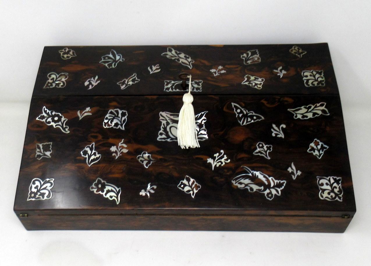 Stunning and rare example of an English well grained ladies Coromandel travelling writing slope of generous proportions. Third quarter of the 19th century, possibly earlier.

The entire outer main area with lavish mother of pearl inlays depicting