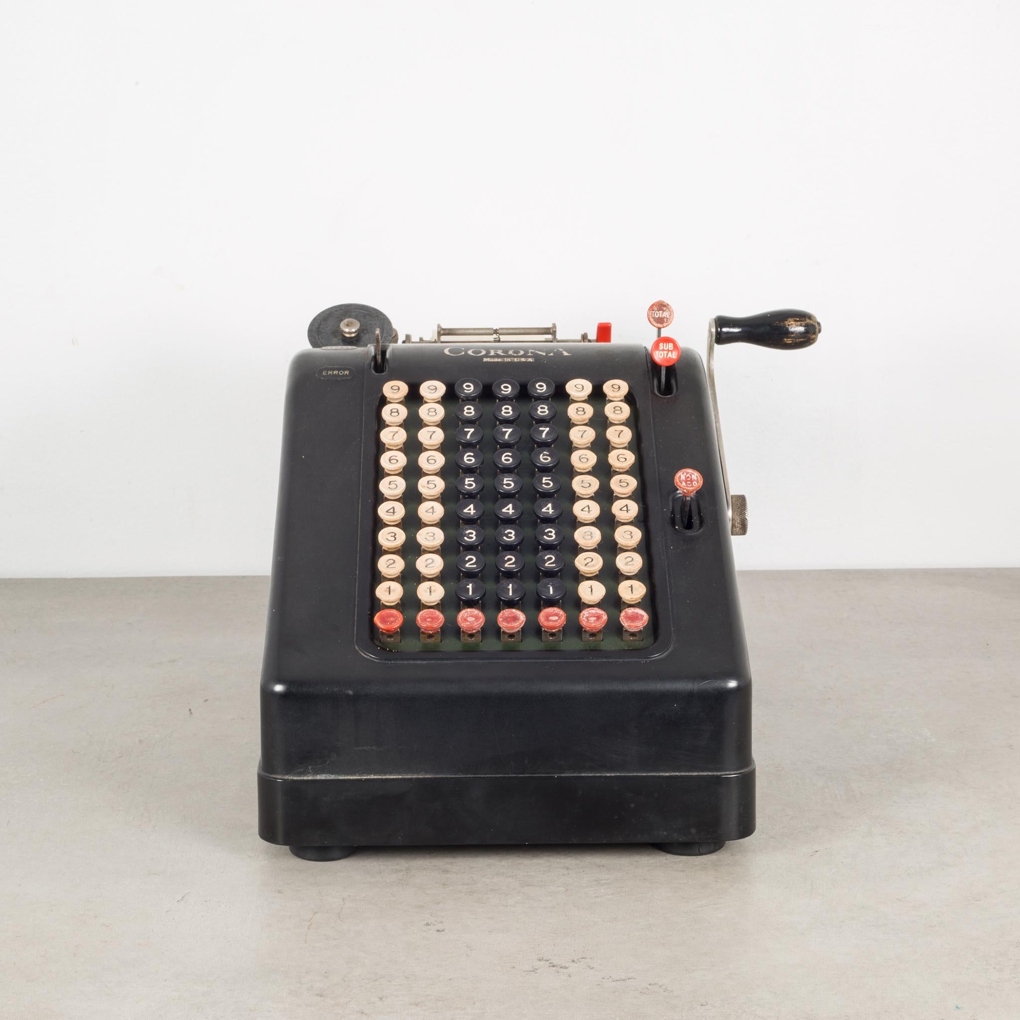 About
The is an antique metal and bakelite adding machine by Corona. The body is Bakelite, metal, and wood on the handle. The lever pulls forward and back working the inner mechanisms but doesn't print on the paper. The black, white and red push