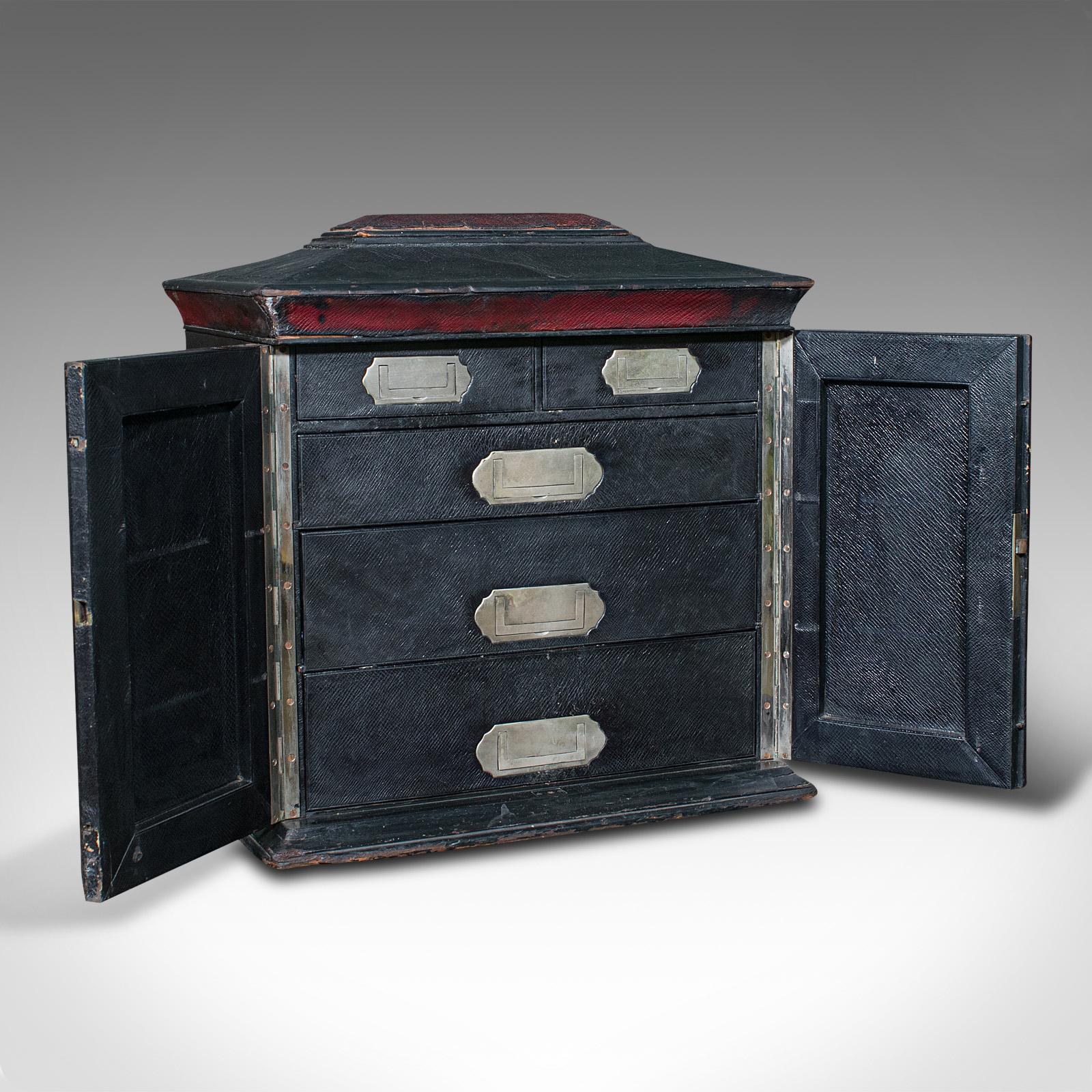 This is an antique correspondence box. An English, leather bound sarcophagus cabinet with secret compartment, attributed to Houghton and Gunn of London, dating to the Victorian period, circa 1870.

Quality gentleman's stationery box with