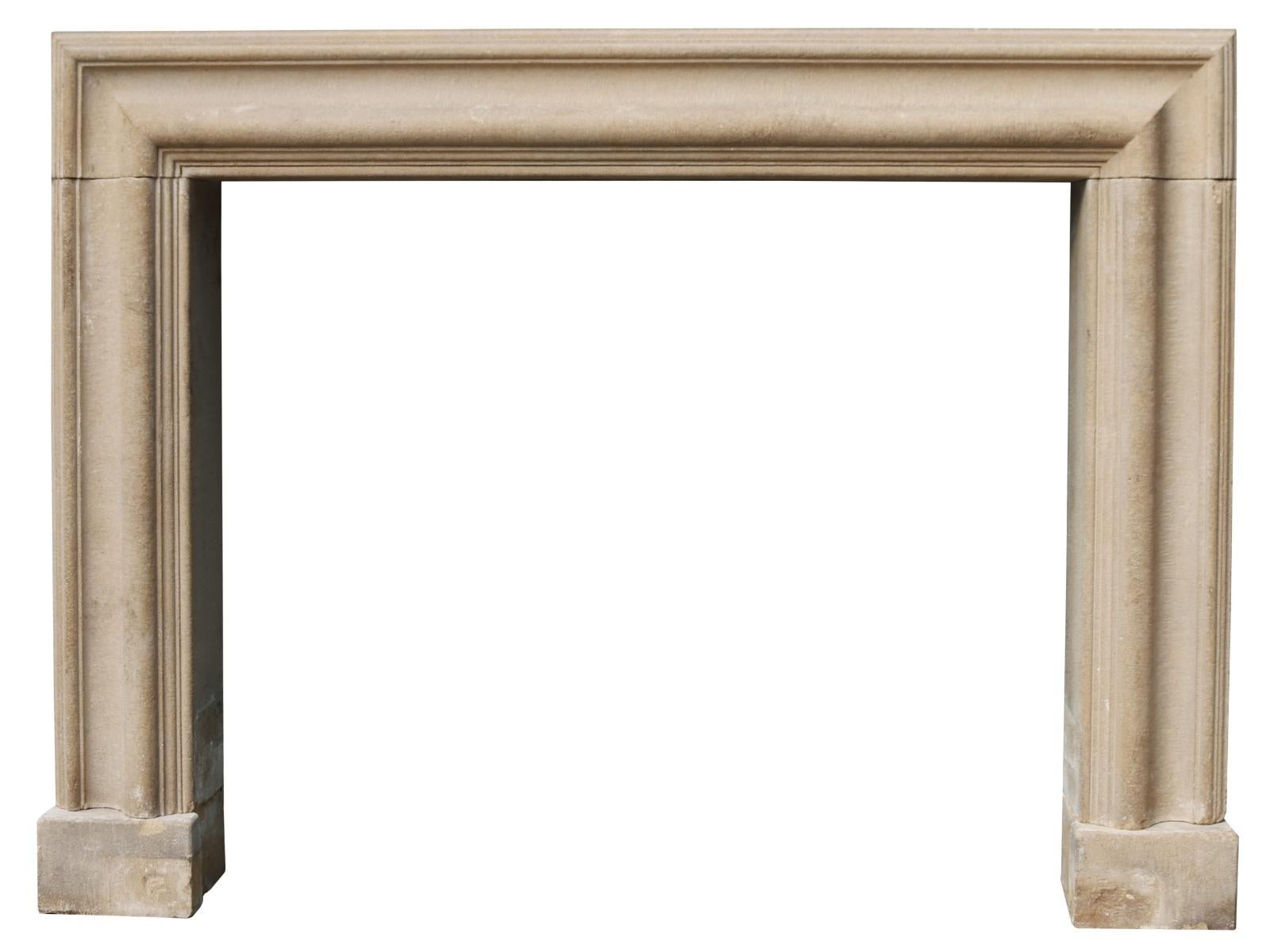 A reclaimed Bolection stone fire surround of large proportions.

Additional Dimensions:

Opening Height 114 cm

Opening Width 137.5 cm

Width between outsides of the foot blocks 185 cm.