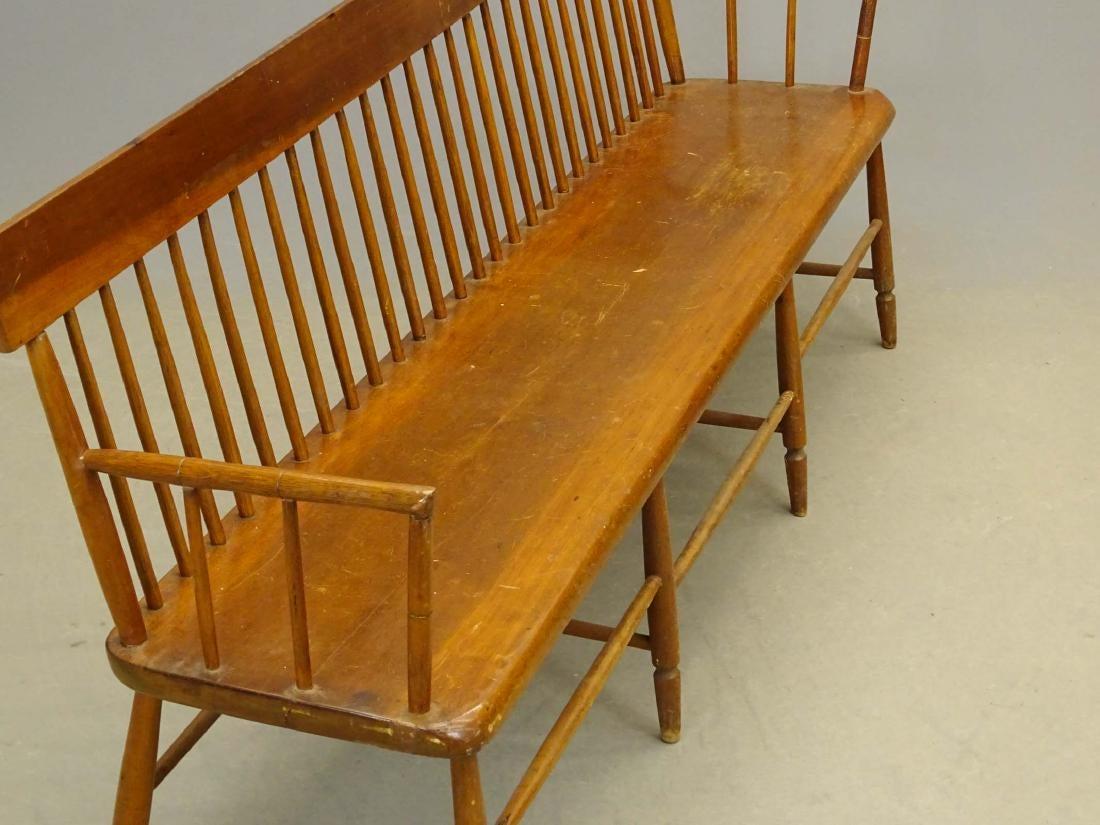 19th century Pennsylvania Deacon's country bench with spindled back and arms. It's widely known that some religious institutions provide such seating for certain respected church “elders”, or “deacons” of the congregation. Often set at a 90 degree