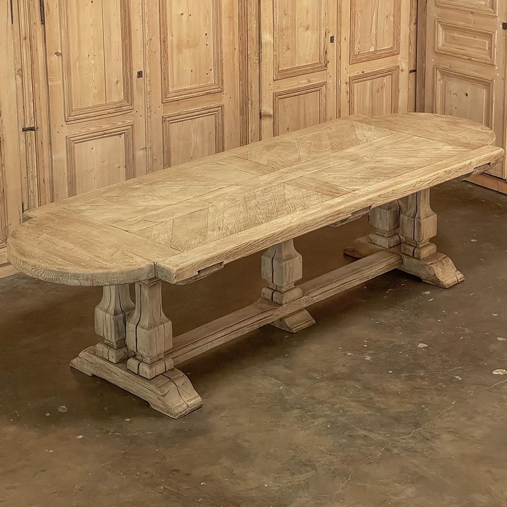 Antique Country French Banquet Table in Stripped Oak was literally built to last for centuries!  Utilizing dense, old-growth oak, the craftsmen cut thick timbers to create the top, which consists of a framework that has demilune rounds on each end