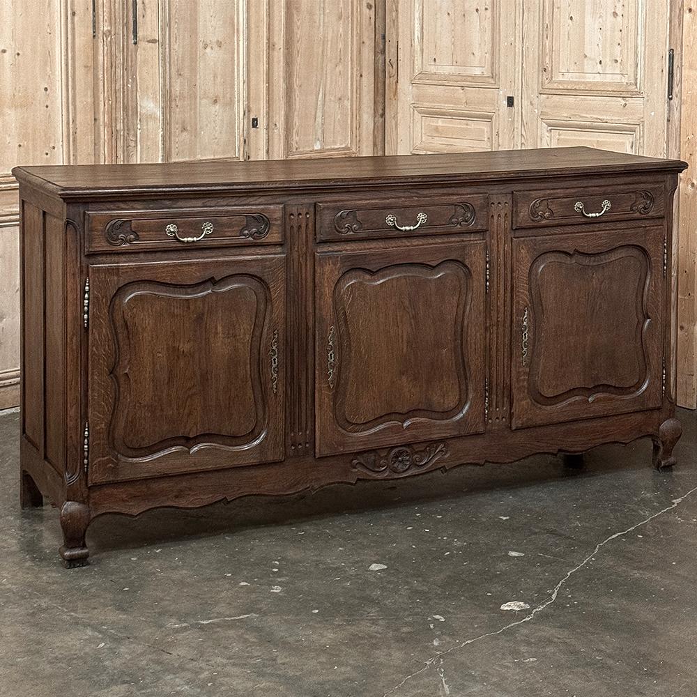 Antique Country French Buffet ~ Sideboard is an timeless design that earned its own nomenclature in the furniture industry in France as a Trois Porte Enfilade, translating to a three door single tier buffet.  The design features a solid plank top