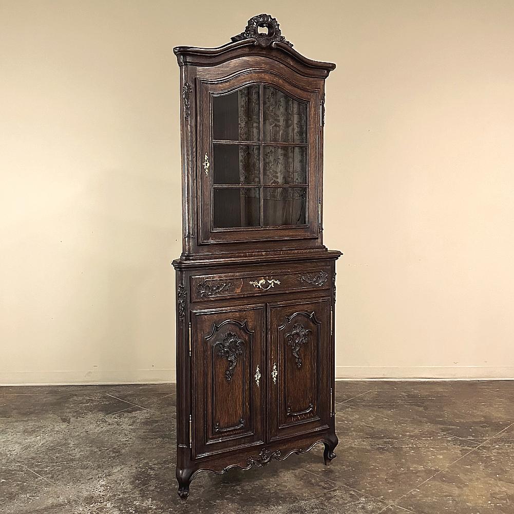Antique Country French Corner Vitrine ~ Cabinet is a special piece, indeed!  Hand-crafted from solid oak by master cabinetmakers, it features a two tiered design that provides display above and storage below, all with timeless provincial flair.  The