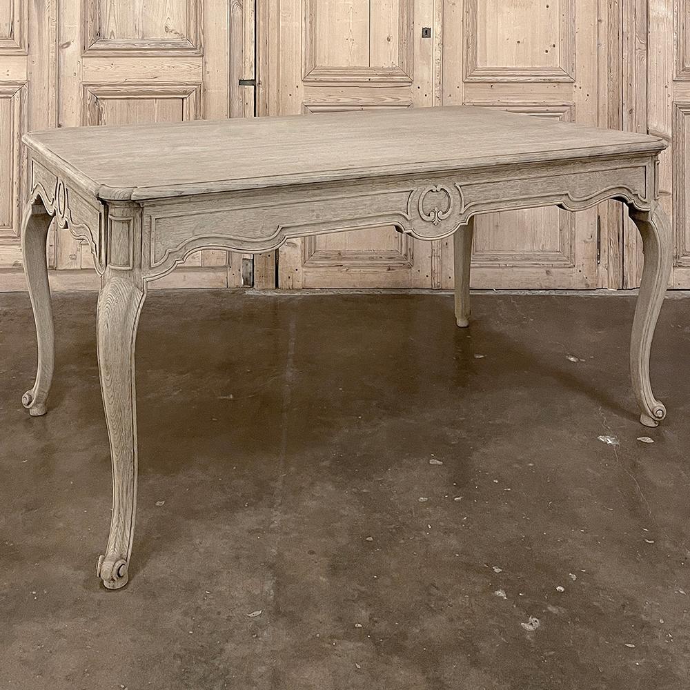 Antique Country French Dining Table with Leaf Extensions is an unusual example of fine craftsmanship, exhibiting restrained styling that is at once elegant yet casual!  Beautifully grained oak was selected to create the piece, with solid posts cut