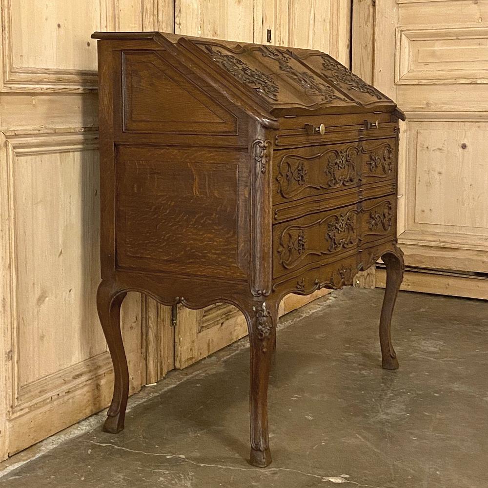 Antique Country French drop-font secretary is a marvel of stylish efficiency! Taking up no more floor space that a medium-sized chest of drawers, it provides the same type of storage with two generous full-width drawers as well as an upper section