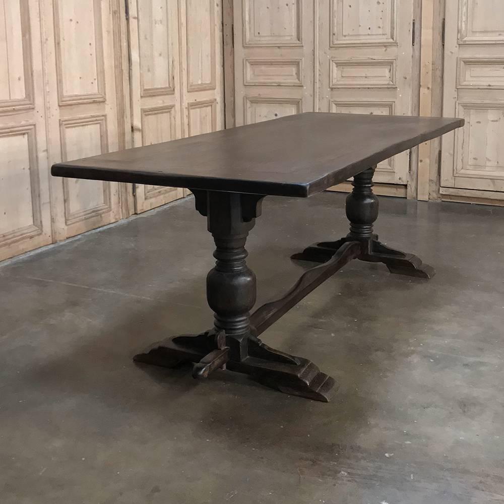 Antique country French farm trestle table` features uncharacteristically long overhands on the ends useful for dining 