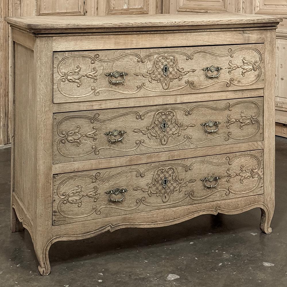 Antique Country French Louis XIV Commode in Stripped Oak is of an interesting size, and certainly makes a fine style statement for a wonderful complement to almost any decor.  Hand-crafted from solid oak, it features a generously sized top and