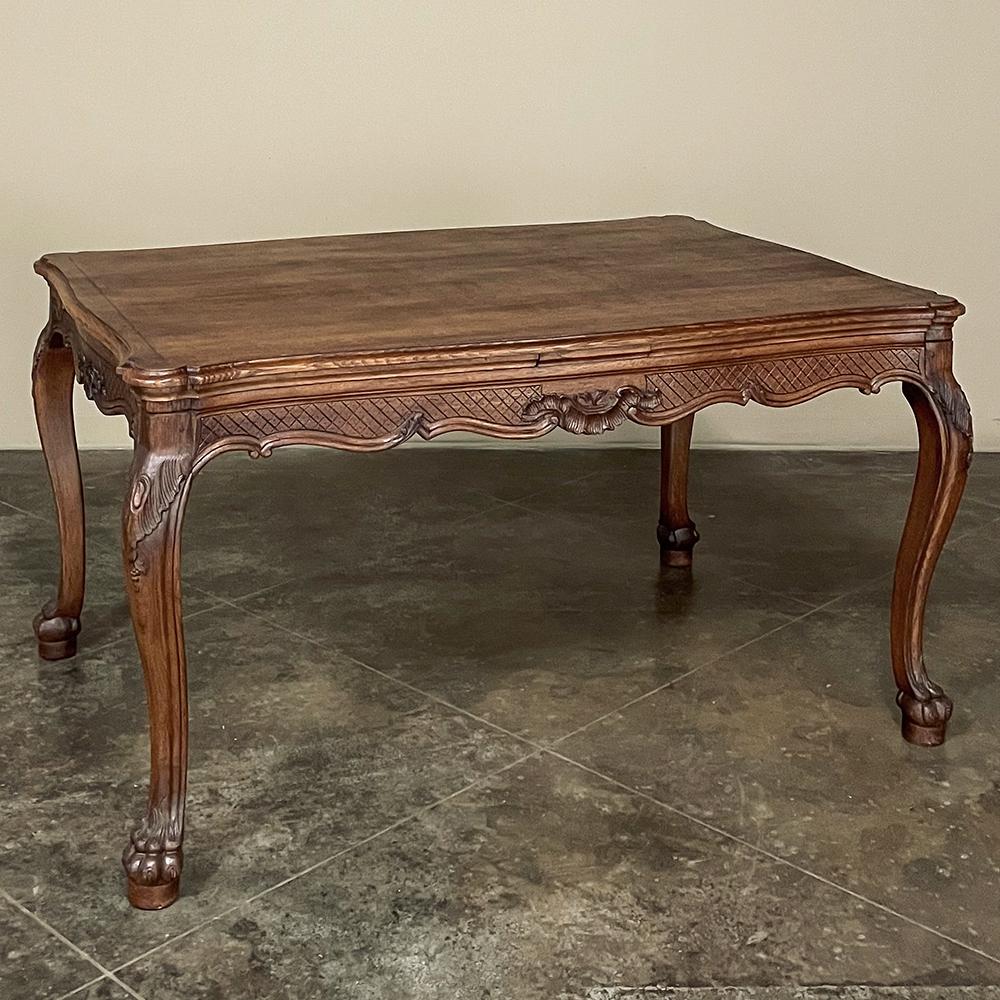 Antique Country French Louis XIV Draw Leaf Dining Table represents a clever design that has two leaves that tuck into slots underneath the main table top when not needed, then draw out easily and quickly when extra guests arrive. Leaves just as