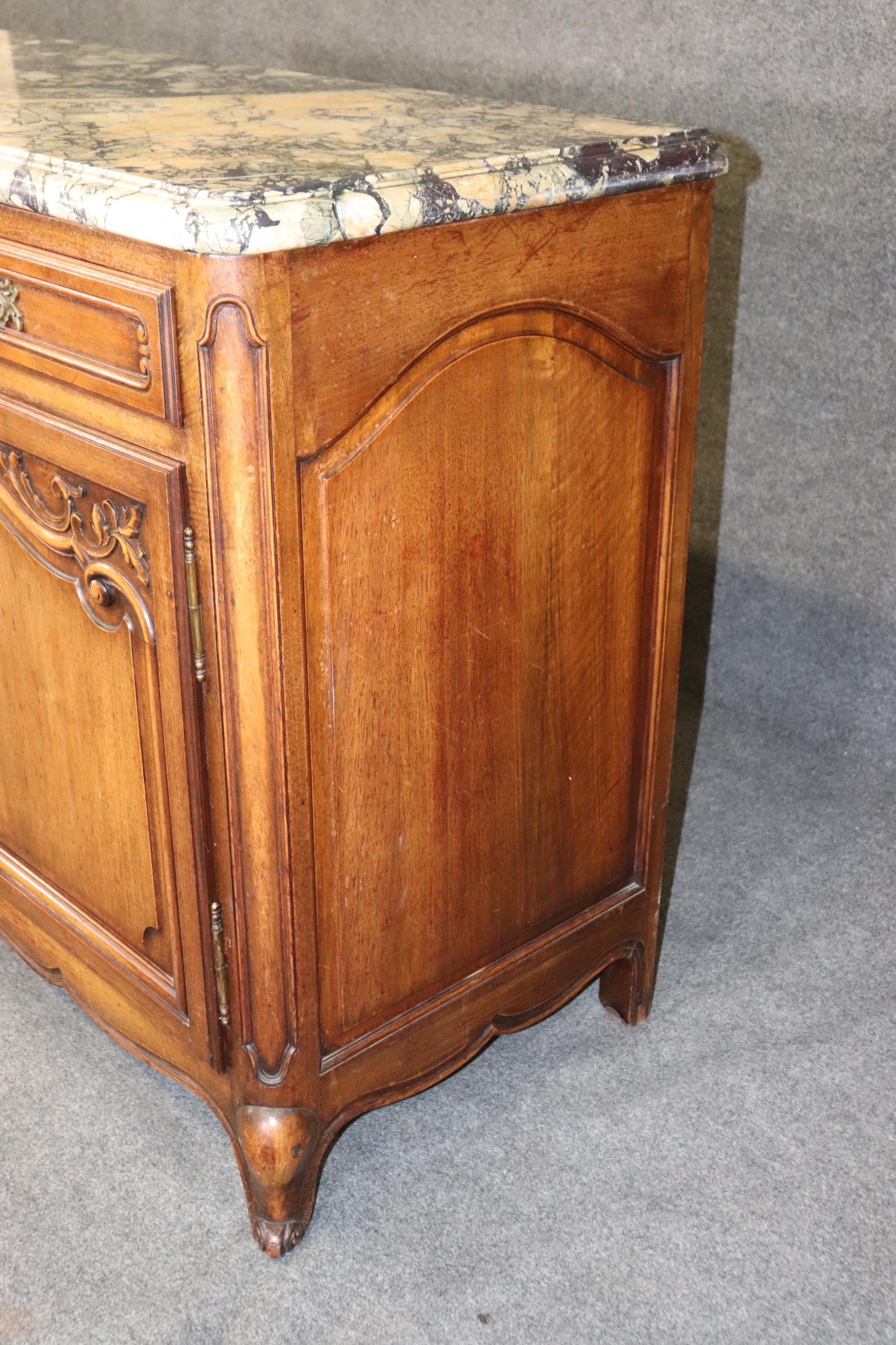 Dimensions- H: 40in W: 77 1/4in D: 22 3/4in 

This antique country French marble top sideboard is made of the highest quality and is bound to bring a sense of class and luxury into your home or place of choosing! If you look at the photos provided,