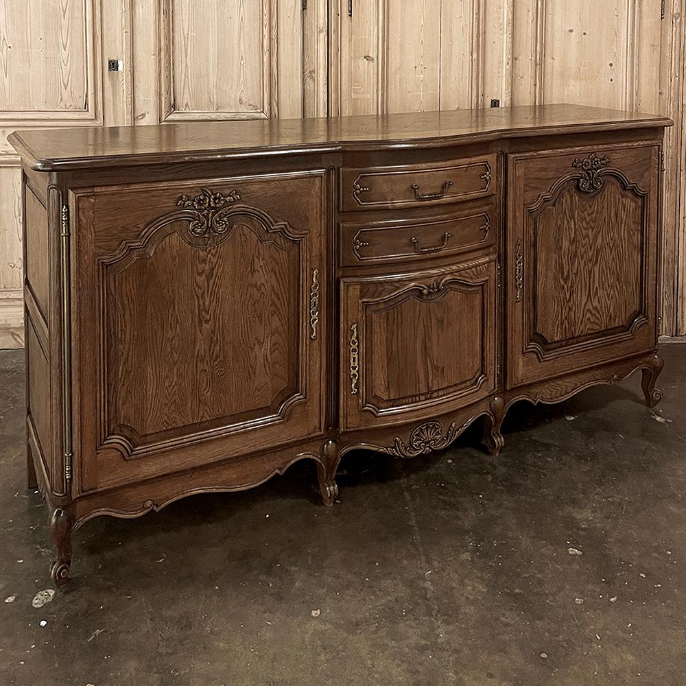 Antique Country French Oak Buffet ~ Enfilade makes a great choice for the casual decor.  The deep cabinets include a subtly rounded center section sporting two bowfront drawers and a bowfront cabinet door designed for storing tureens and larger