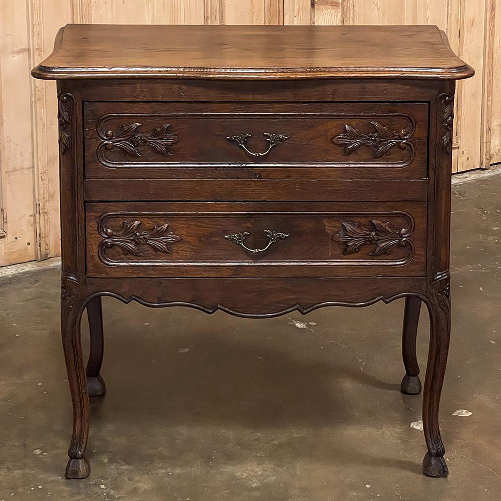 Antique Country French Petite commode was hand-crafted from solid oak, and features a timeless style that will endear it to your home in an instant! Small enough to place just about anywhere, it still provides a substantial surface and storage