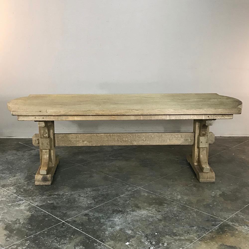 Antique Country French Provincial stripped oak trestle table is as sturdy as they come! This is a table your family will enjoy for generations to come. Imagine the memories that will be made along the way! Handcrafted from thick planks and timbers