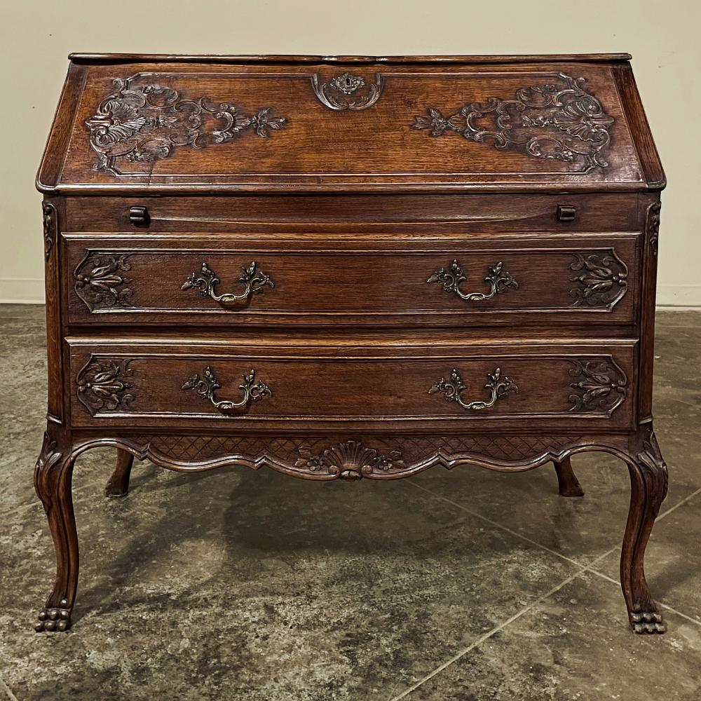 Antique Country French Secretary is the perfect answer to an efficient floor plan or a cozy room! Combining storage in the spacious pair of full-width drawers with a drop down desk surface with no less than six small drawers inside, it provides