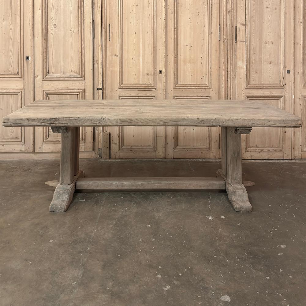 Antique Country French Stripped Oak Trestle Table is the perfect choice for the casual or rustic decor!  Hand-crafted from thick planks and timbers of solid oak, it was literally built to last for generations!  The 4 inch thick top is so sturdy it