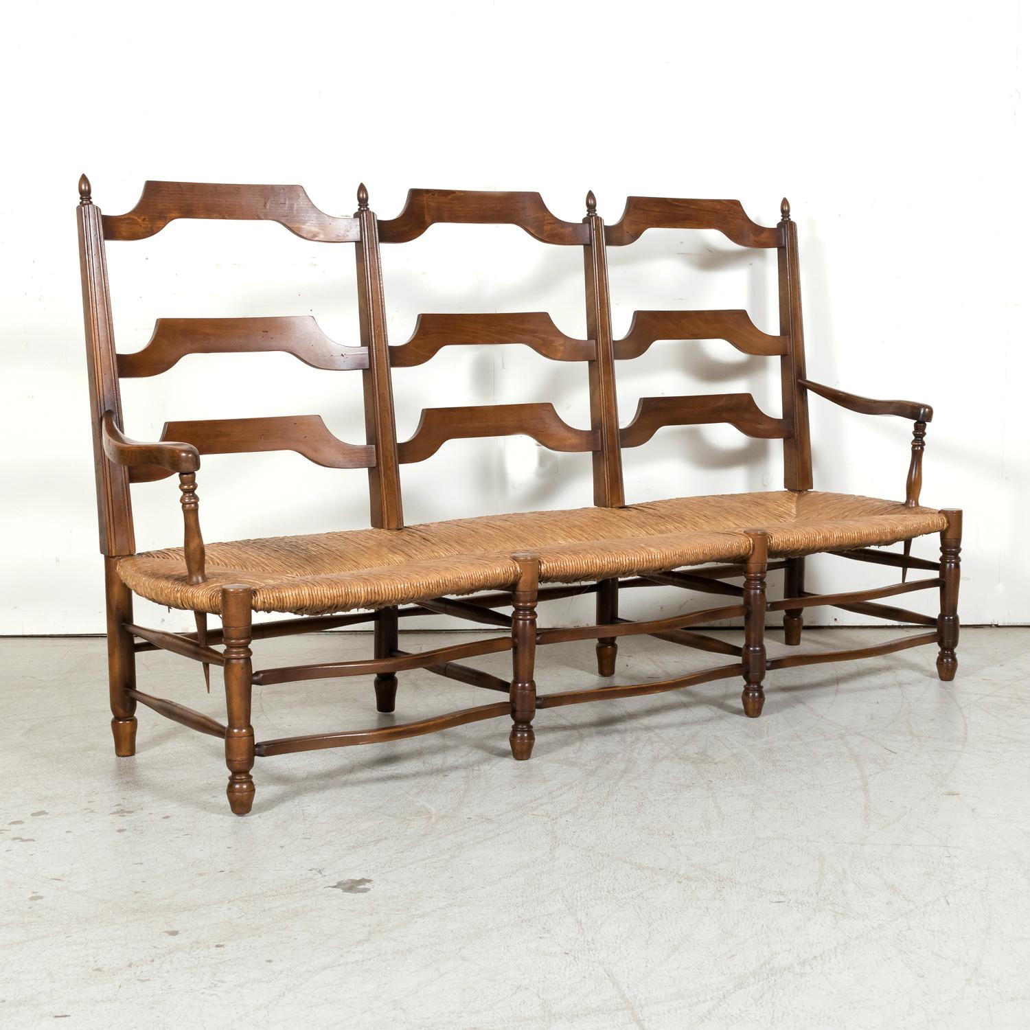 Late 19th Century Antique Country French Walnut Ladder Back Settee or Radassier with Rush Seat For Sale