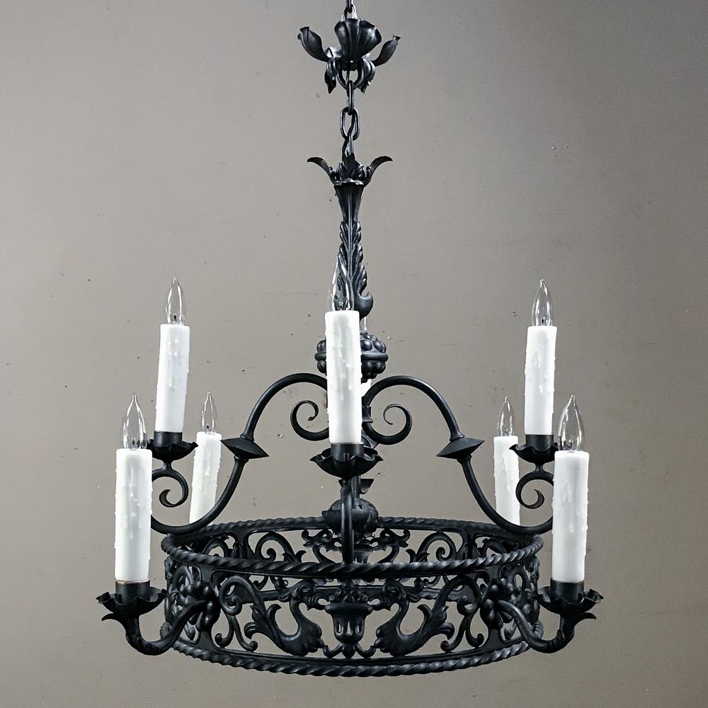 Antique Country French wrought iron chandelier features elaborately scrolled arms embellished with foliates, urn and animalistic motifs. Two tiers of chandelles create a nice effect.
Newly wired, included in the price!
circa early 1900s
Fixture