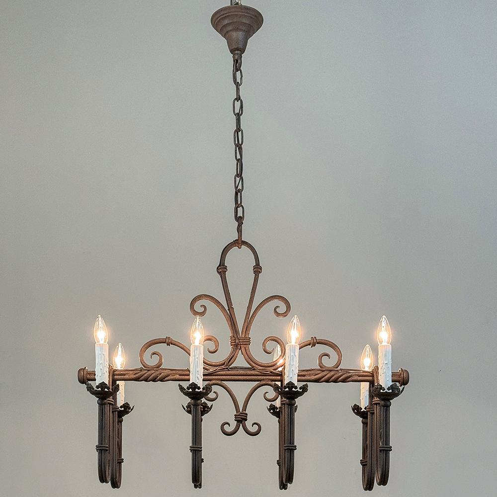 Antique Country French Wrought Iron Chandelier is a timeless design, featuring a prominent fleur de lys taking center stage!  A substantial length of original chain with canopy survives, making it flexible for mounting height by removing links as